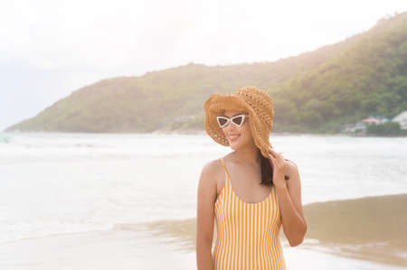 A Young Beautiful woman in Bikini enjoying and relaxing on the beach,  Summer, vacation, holidays,...