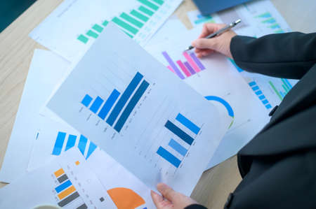 Top view of Documents with analytics data lying on table,selective focusの写真素材