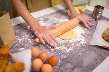 A Close up of Young beautiful woman is baking in her kitchen , bakery and coffee shop businessの写真素材