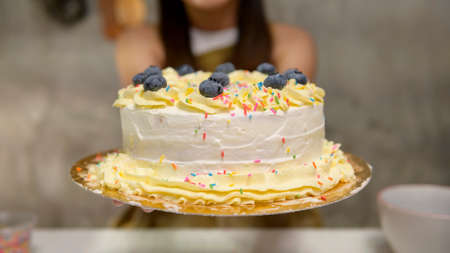 Close up of Young beautiful woman is baking in her kitchen , bakery and coffee shop businessの写真素材