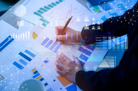 Background of documents with analytics data lying on tableの写真素材