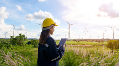 a woman engineer is wearing a protective helmet on her head, using tablet Analytics engineering...