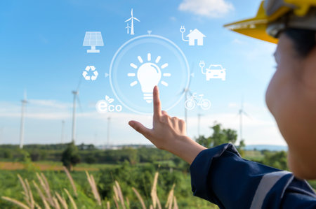 Close up engineering woman hand is touching virtual reality Analytics engineering data in a field over electrical turbines backgroundの写真素材