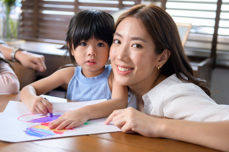 Asian family with children Drawing and painting on table in playing room at home, Educational game.