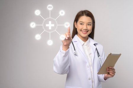 A Portrait of female confident doctor over white background studio, healthcare and Medical technology concept.の写真素材