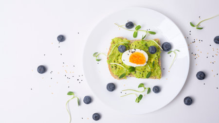 Bread with avocado , vegetables fruit and egg on white background , Healthy breakfast concept