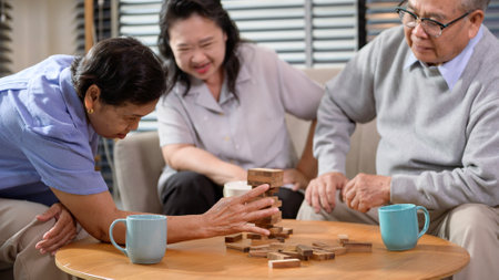Group of elderly people enjoy talking , relaxing with game at  senior healthcare center.の写真素材
