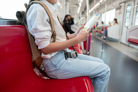 A Beautiful tourist woman on vacation traveling on the subway train, Holidays concept