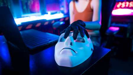 A Hacker is using laptop computer to steal data in the nightの写真素材