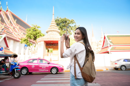 A Beautiful tourist woman on vacation sightseeing and exploring Bangkok city, Thailand, Holidays and traveling conceptの写真素材