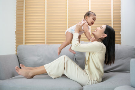 A Portrait of mother and baby girl at home, family, child, childhood and parenthood concept