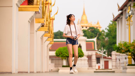 Beautiful young Asian tourist woman on vacation sightseeing and exploring Bangkok city, Thailand, Holidays and traveling conceptの写真素材