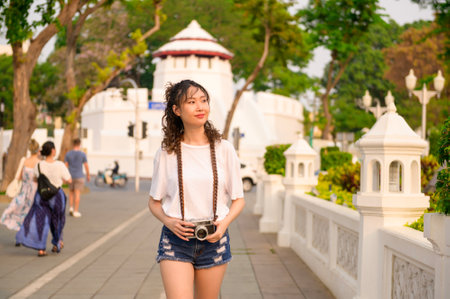 Beautiful young Asian tourist woman on vacation sightseeing and exploring Bangkok city, Thailand, Holidays and traveling conceptの写真素材