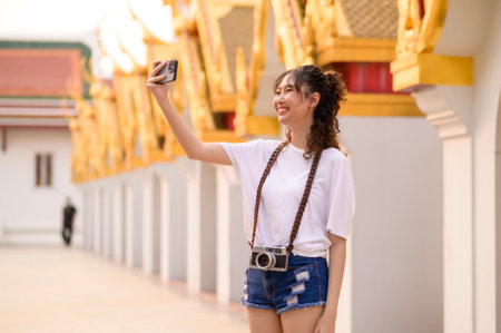 Beautiful young Asian tourist woman on vacation sightseeing and exploring Bangkok city, Thailand, Holidays and traveling conceptの写真素材