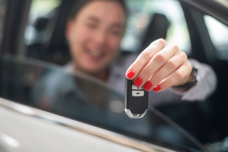 A young beautiful woman driving her carの写真素材