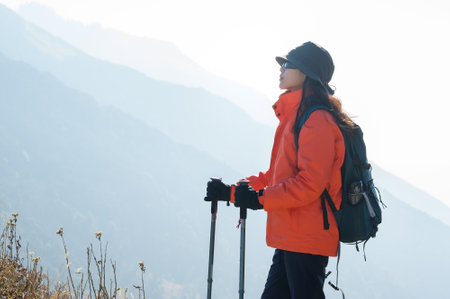 A young traveller trekking on forest trail , Nepalの写真素材