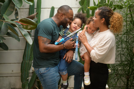 Portrait of Happy African American family enjoying gardening at home