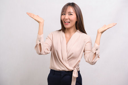 A Portrait of beautiful asian businesswoman over white background studioの写真素材