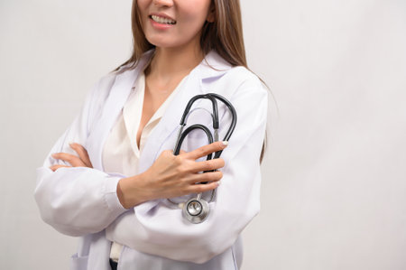 A Portrait of female confident doctor over white background studio, healthcare and Medical technology conceptの写真素材