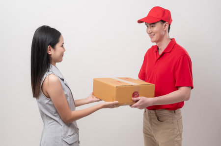 Asian man delivery sending cardboard box to woman over white background