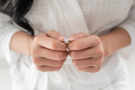 Bride in White bathrope with elegant diamond ring preparing for wedding day, Love and marriage...