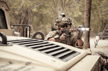United States Army in camouflage uniforms operation in the forestwith armored vehicle, soldiers...