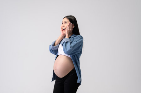 Portrait of Beautiful pregnant woman on white backgroundの写真素材