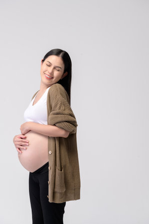 Portrait of Beautiful pregnant woman on white background