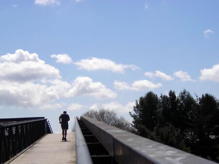 An old age runner, climbing upwards a ramp.の写真素材
