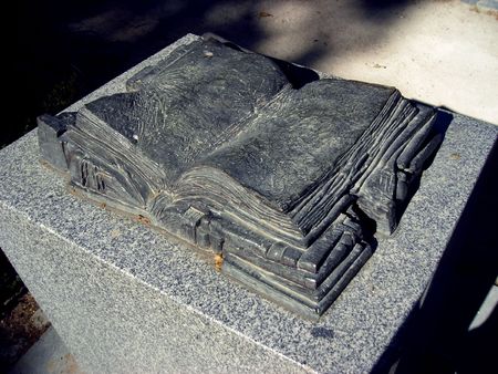 Black stone book located in the Retiro Gardens in Madrid.の写真素材