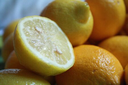 Half a lemon in a group of fruitsの写真素材