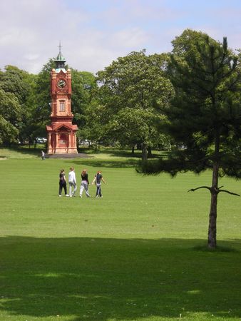 Some teenagers walking across Preston Park in Brighton, East Sussex, UK.の写真素材