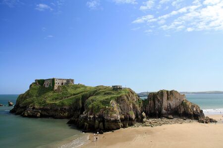 Summer low tide view of the Saint Catherine Island and South Beach at Tenby, Wales.の写真素材