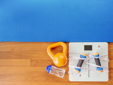 weight loss and physical activity concept from weight scale digital with measure tape for check body...