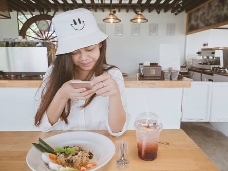 Food photography hobby and casual relaxed lifestyle concept from beautiful asian girl taking photo...