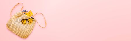 summer straw bag for women and credit card on pastel red background. For advertising sale products and website where that place banner ads. shopping and payment concept.の写真素材