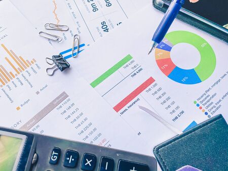 analytics graph and pie chart on many paperwork and statistical. business workplace and finance...