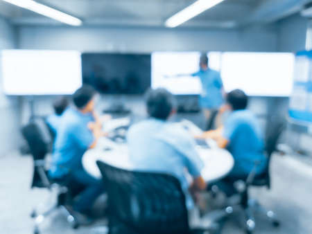 abstract blur background of employees sitting at the business meeting in boardroom.の写真素材