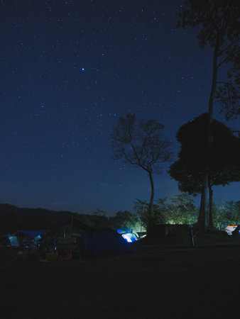 landscape beautiful of night sky and starry at camping ground, Khao Yai National Park, Thailandの写真素材