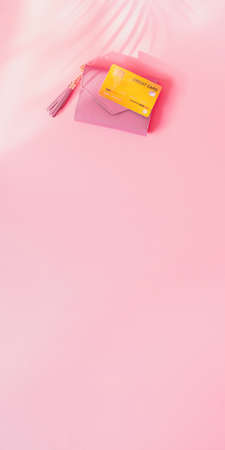 shopping and payment concept from pink wallet with credit cards or discount card on pink background. web banner size.の写真素材