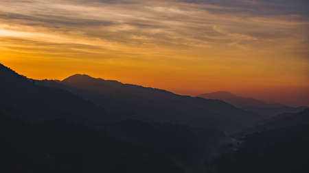 Sun sunrise bright sunlight over mountain.の写真素材