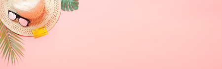 summer accessories concept from credit card and summer collection on pastel pink background. web banner size.の写真素材