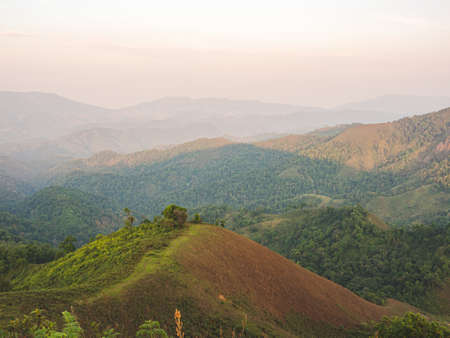 Beautiful nature of sunset and mountains complex with evening atmosphere at Tak, Thailand.の写真素材