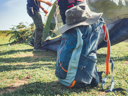 Camping adventure concept from blue hiking backpack and trekking hat.の写真素材