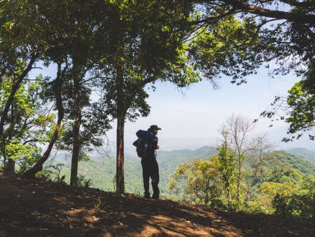 Trekking solo backpack on mountain trail in tropical forest at Tak Province, Thailand.の写真素材