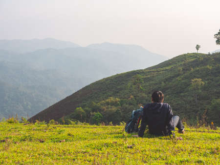 Trekking solo backpack on mountain trail in tropical forest at Tak Province, Thailand.の写真素材