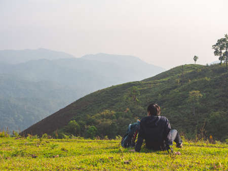 Trekking solo backpack on mountain trail in tropical forest at Tak Province, Thailand.の写真素材