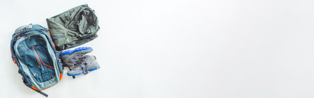 Hiking gear and camping equipment for travel on white background. web banner size.