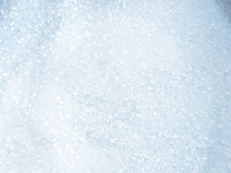 Close-up of white plastic pellets used as raw material for injection molding.