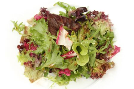 Salad mix with rucola on white backgroundの写真素材